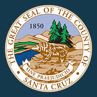 Santa Cruz County Seal. Drawing of a bear near a shoreline with evergreen trees in the background