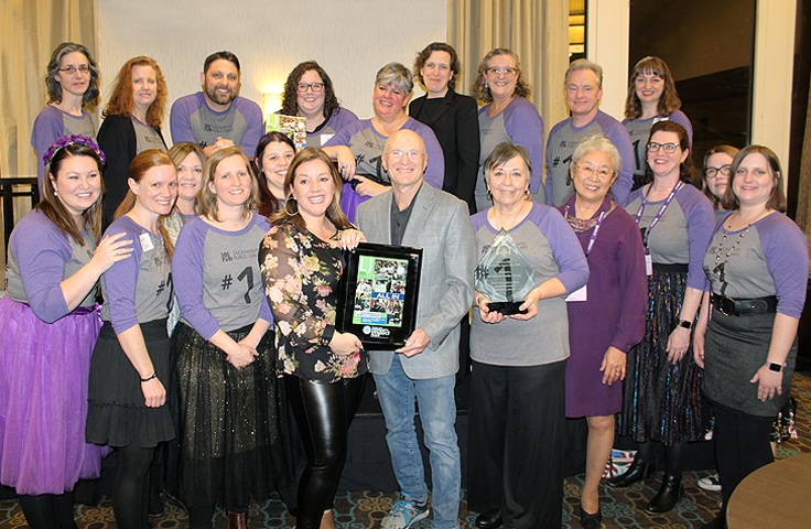 Sacramento Public Library staff and director and others on stage at Jerry Kline Community Impact Award Reception at PLA