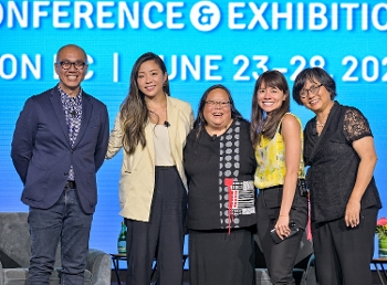 Philip Lee, Jane Park, Patty Wong, Christina Soontornvat, and Linda Sue Park, standing together and smiling