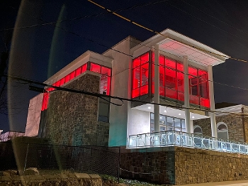 Mamaroneck Public Library exterior lit up with red lights