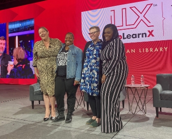 four women standing on stage at LibLearnX president's panel
