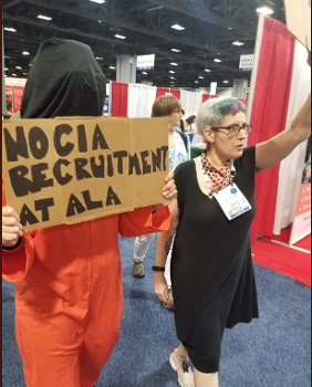Organizers from Librarians for Democracy protesting the CIA booth at ALA