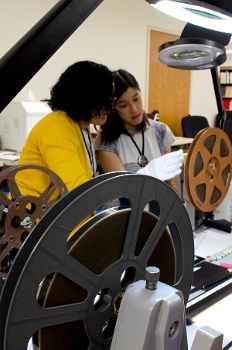 Two women working with a film reel at BAVASS
