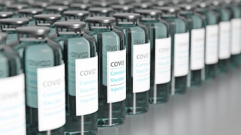 Bottles of COVID vaccine doses lined up