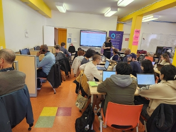 Patrons work on laptops at Queens Public LIbrary's Queensbridge Tech Lab during the Edit-a-Thon